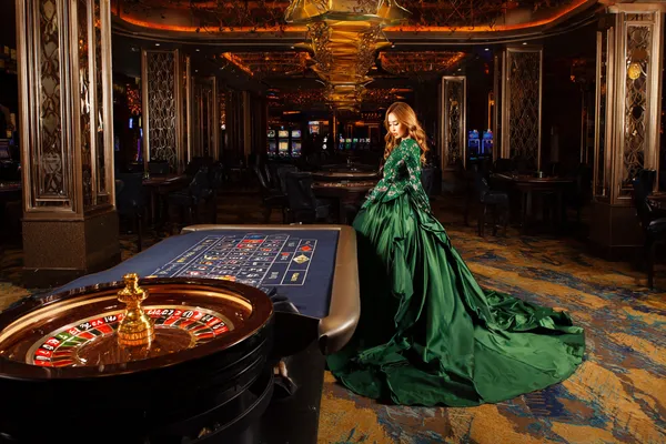 2G777 App — Enjoy seamless gaming on your smartphone A young woman relaxing with her phone while dynamic casino elements float around her, illustrating the smooth mobile experience offered by the 2G777 app.