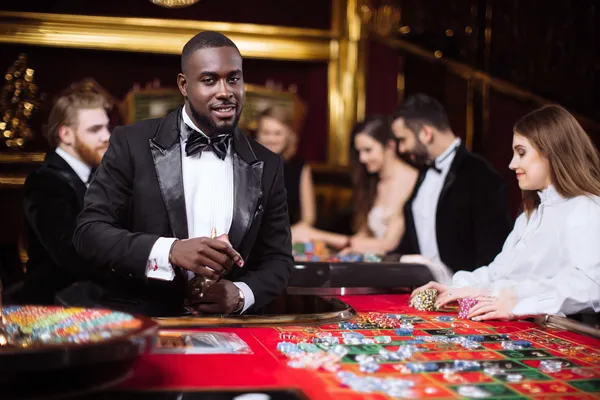 2G777 Jackpot Slots — Spin for massive rewards A dramatic shot of winning sevens landing on a slot reel surrounded by shining gold coins, symbolizing big wins.