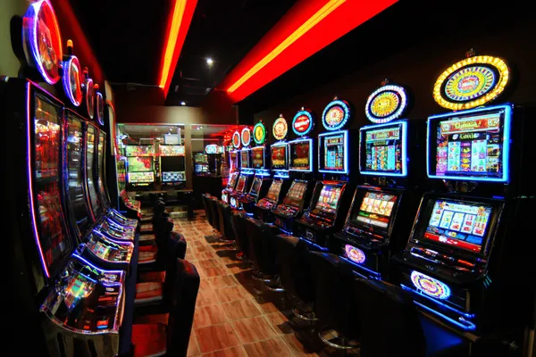 A confident dealer surrounded by casino chips inviting players to access their 2G777 account, reflecting quick and easy login options.